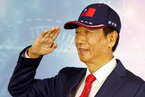 Terry Gou, founder of Taiwan's Foxconn, poses for pictures while saluting during a news conference in Taoyuan, Taiwan 5 April 2023 (Photo: REUTERS/Carlos Garcia Rawlins).