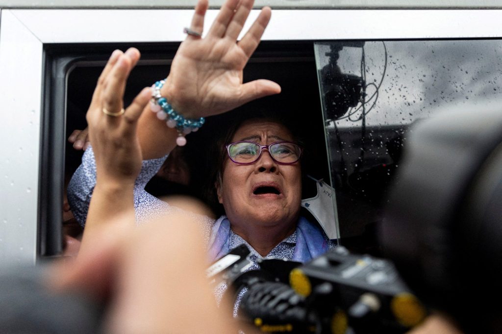 Former Philippines senator Leila de Lima waves to her supporters outside the Muntinlupa Hall of Justice after being granted bail following six years in detention, at Muntinlupa, Philippines, 13 November 2023 (Photo: Reuters/Eloisa Lopez).