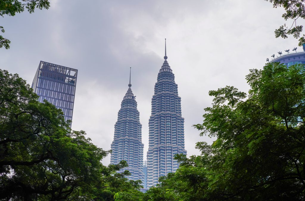 The Petronas Towers, a pair of twin skyscrapers, stand in the city centre of Kuala Lumpur, Malaysia, 12 March 2020 (Photo: Chang An/Oriental Image via Reuters).