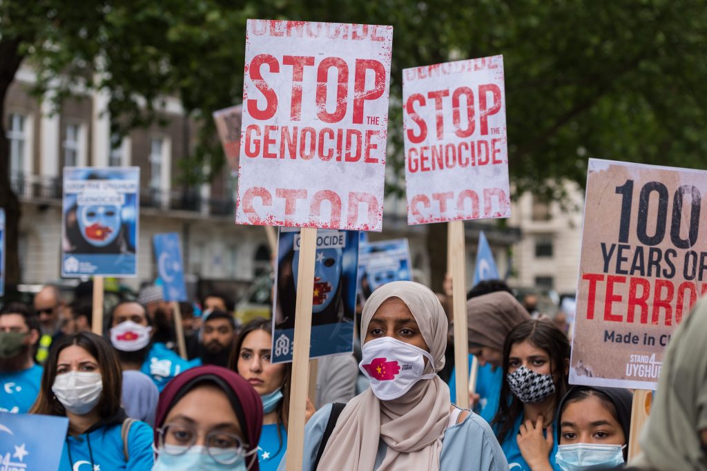 Protesters demonstrate in front of the Chinese Embassy in support of the repressed Uyghur Muslim community living in Xinjiang in northwest China on the 100th anniversary of the founding of the Chinese Communist Party in London, England, 1 July 2021 (Photo: WIktor Szymanowicz/NurPhoto via Reuters).