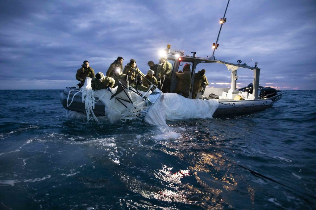 US Navy sailors assigned to Explosive Ordnance Disposal Group 2 recover the Chinese spy balloon off the coast of Myrtle Beach, South Carolina, United States, 5 February 2023 (Photo: US Navy/Eyepress via Reuters).