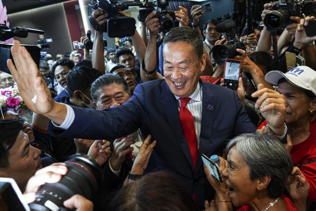 Thailand's newly elected Prime Minister Srettha Thavisin greets supporters after winning the parliamentary vote to become next prime minister, at Pheu Thai Party's headquarters in Bangkok, Thailand, 22 August 2023 (Photo: Reuters/Anusak Laowilas).