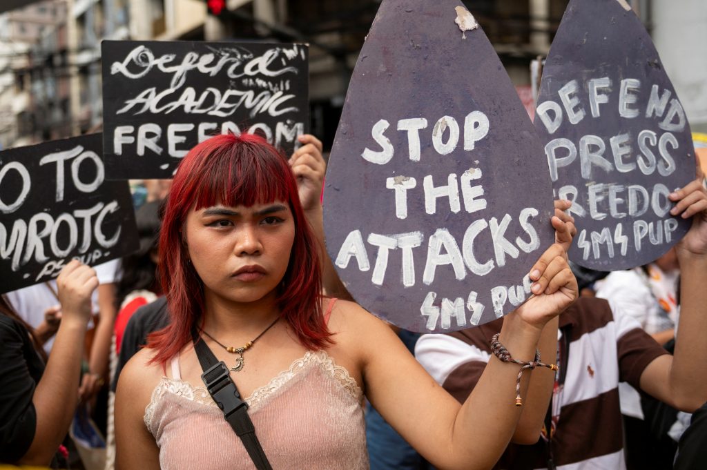 A Filipino activist holds a placard during a Human Rights Day protest in Manila, Philippines, 10 December 2023 (Photo: Lisa Marie David/Reuters).