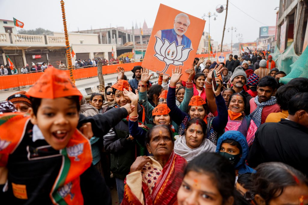 Supporters of the Bharatiya Janata Party (BJP) react after India's Prime Minister Narendra Modi's roadshow in Ayodhya, India, 30 December 2023 (Photo: Reuters/Anushree Fadnavis).