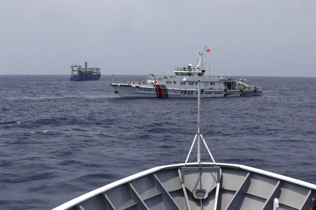 A Chinese Coast Guard ship blocks the direction of a Philippine Coast Guard ship conducting a resupply mission for Filipino troops stationed in the South China Sea, South China Sea, 4 October 2023 (Photo: Reuters/Adrian Portugal).