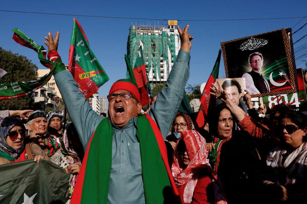 Supporters of former Prime Minister Imran Khan's party, the Pakistan Tehreek-e-Insaf (PTI), chant slogans as they gather during a protest demanding free and fair results of the elections, outside the provincial election commission office in Karachi, Pakistan, 17 February 2024 (Photo: Reuters/Akhtar Soomro).