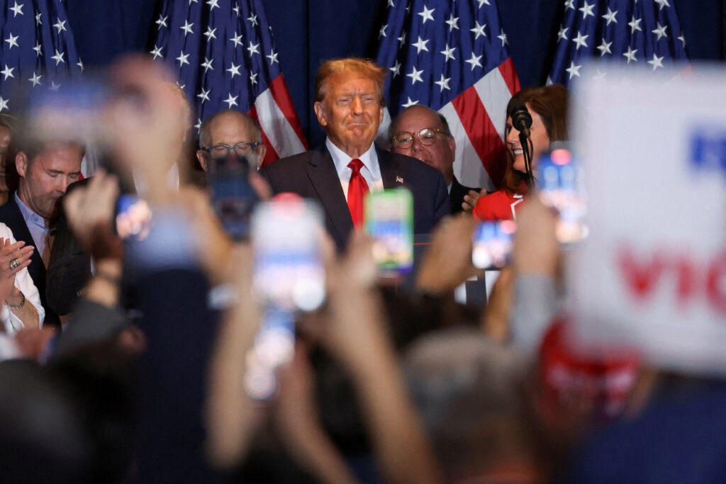 Republican presidential candidate and former US President Donald Trump stands on stage as he hosts a South Carolina Republican presidential primary election night party in Columbia, South Carolina, US, 24 February 2024 (Photo: Reuters/Shannon Stapleton).