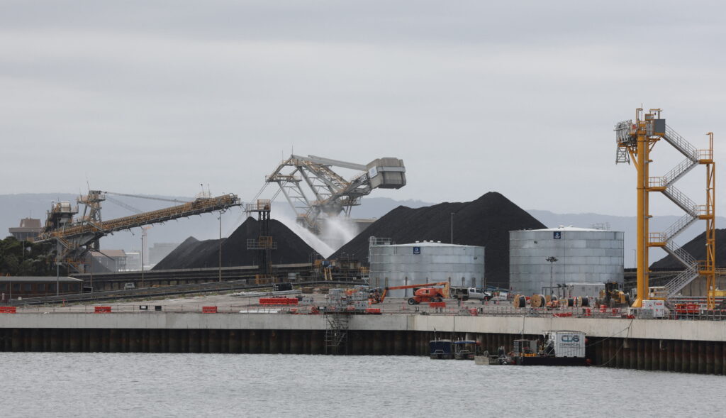 Machinery function at Port Kembla coal terminal in Wollongong, Australia, 9 February 2024 (Lewis Jackson/ Reuters).