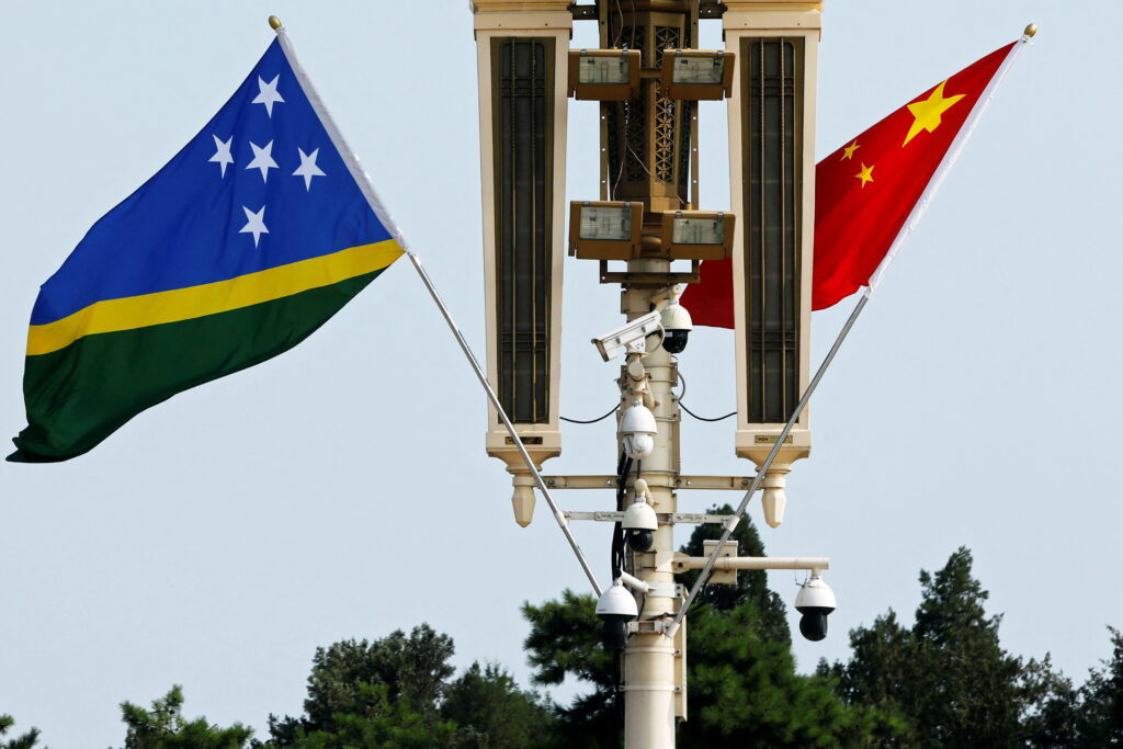 The flags of Solomon Islands and China flutter near the Tiananmen Gate, Beijing, China, 11 July 2023 (Photo: Reuters/Florence Lo).