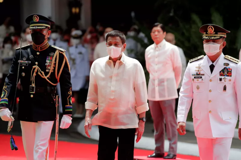Outgoing Philippine President Rodrigo Duterte is escorted during the inauguration ceremony of incoming President Ferdinand 'Bongbong' Marcos Jr, Manila, Philippines, 30 June 2022 (Photo: Pool via Reuters/Francis R Malasig).