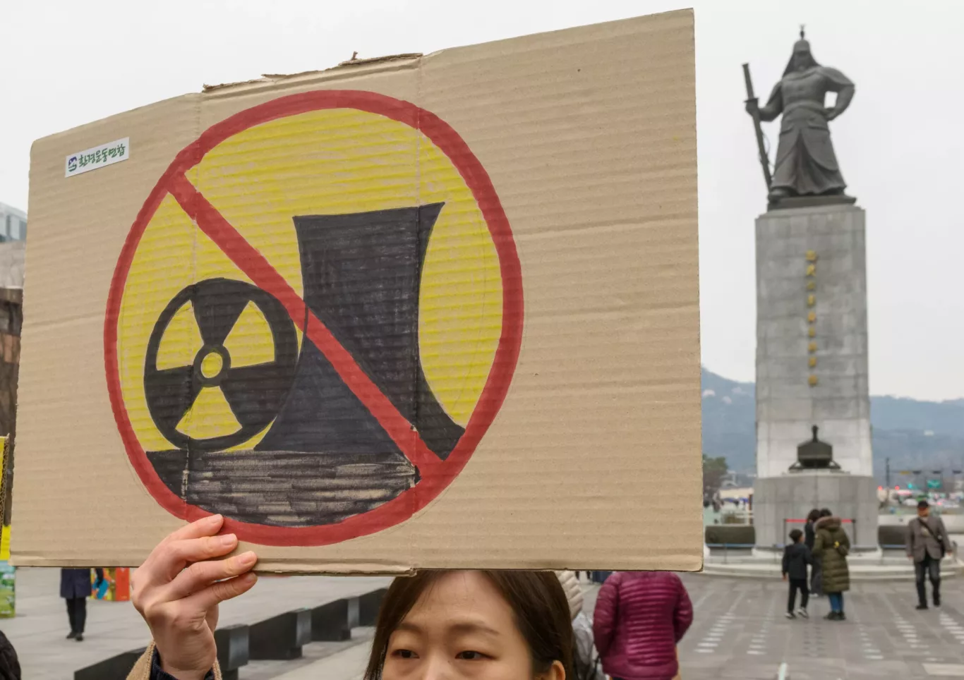 A South Korean environmental activist holds a banner during the anti-nuclear and anti-fossil energy rally at Gwanghwamun Square in central Seoul on 11 March 11, 2024 (Photo: Reuters/Kim Jae-Hwan / SOPA Images)