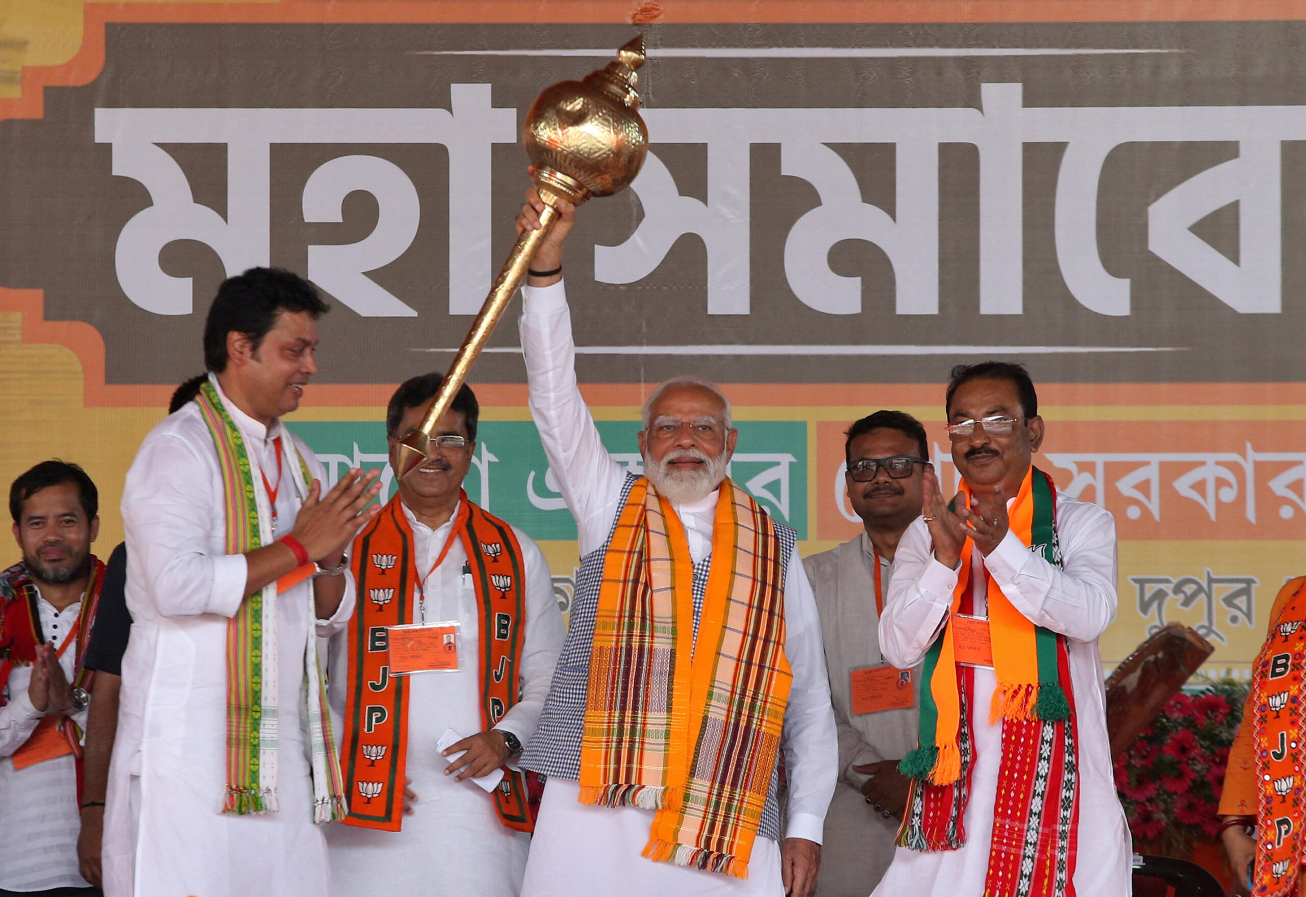 India's Prime Minister Narendra Modi holds up a mace during an election campaign rally in Agartala, India, 17 April 2024 (Photo: Reuters/Jayanta Dey).