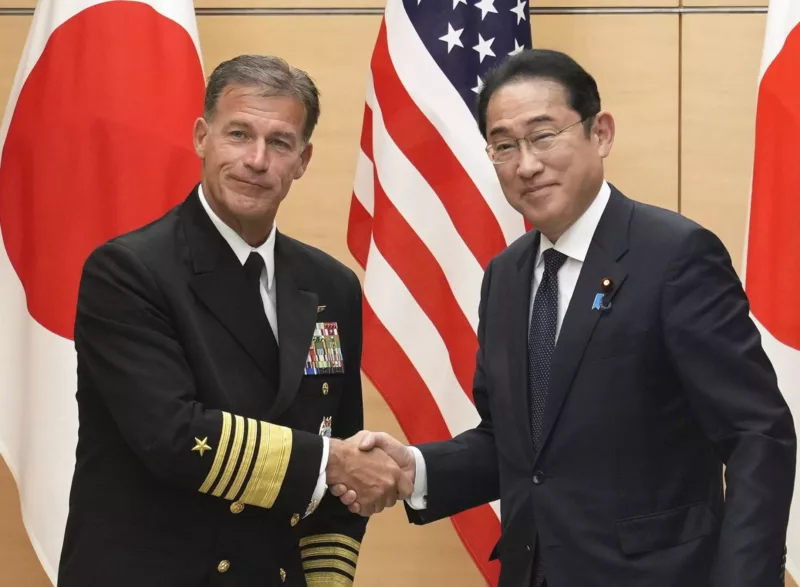 Japanese Prime Minister Fumio Kishida (R) shakes hands with Admiral John Aquilino, commander of the US Indo-Pacific Command, at the premier's office in Tokyo, Japan, 22 April 2024 (Photo: Reuters/Kyodo).