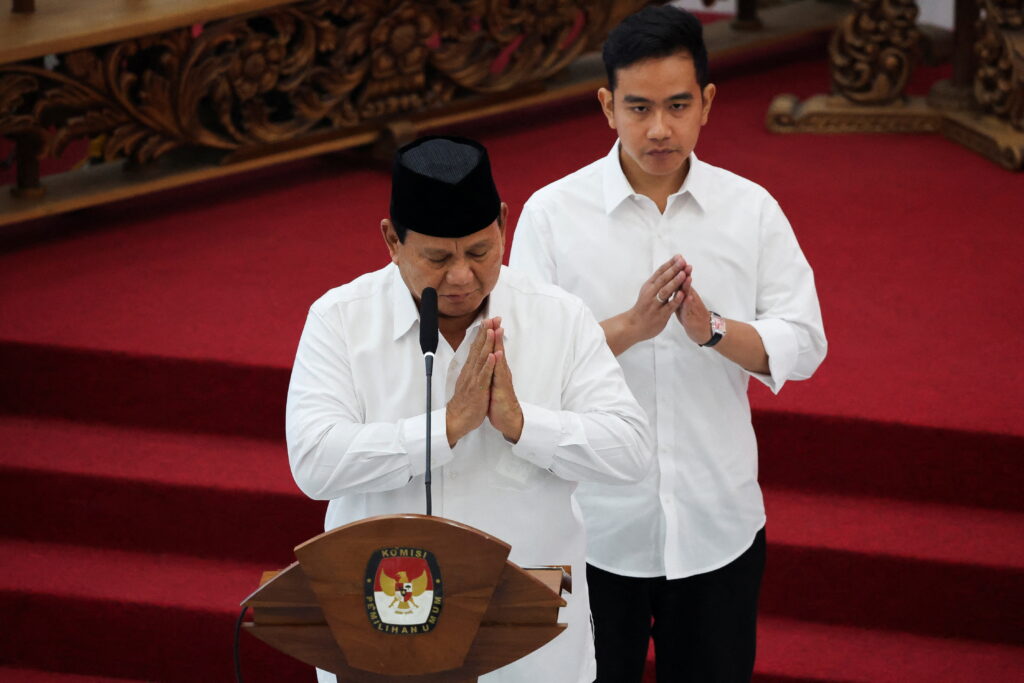Indonesia's president-elect Prabowo Subianto and vice president-elect Gibran Rakabuming Raka gesture before delivering their speech at General Election Commission headquarters during the country's election commission officially announcing the presidential election winners in Jakarta, Indonesia, 24 April 2024 (Photo: Reuters/Ajeng Dinar Ulfiana).