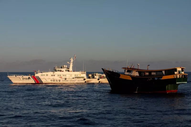 A Chinese Coast Guard vessel blocks the Philippine resupply vessel Unaizah May 4, on its way to a resupply mission at Second Thomas Shoal in the South China Sea, 5 March 2024 (Photo: Reuters/Adrian Portugal).