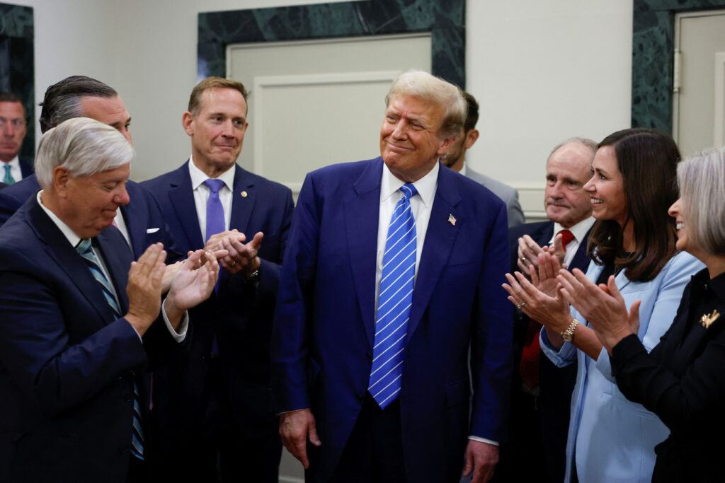 Former US President and Republican presidential candidate Donald Trump reacts as he is applauded by Republicans at the National Republican Senatorial Committee (NRSC) headquarters in Washington, US, 13 June 2024 (Photo: Reuters/Evelyn Hockstein).